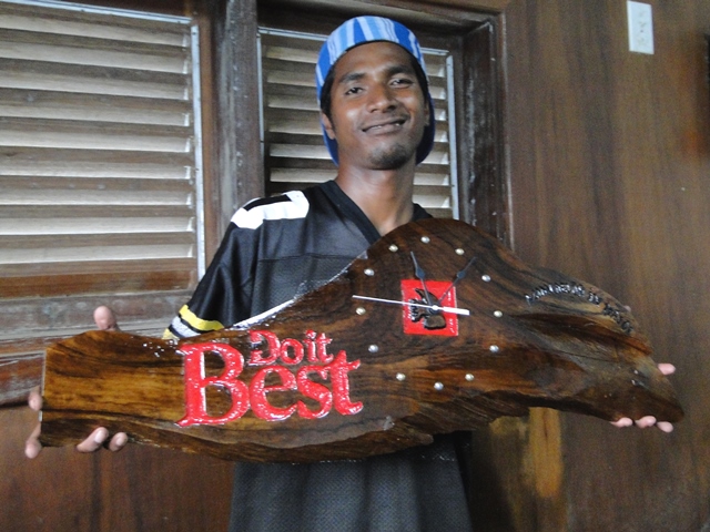 Former WAM trainee Rinky Hersey with a clock he produced for Majuro hardware store Do It Best.