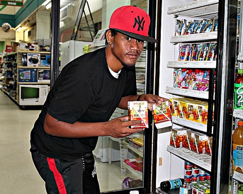 John Juadrik stocking the coolers at K&K. Photo: Tolina Tomeing